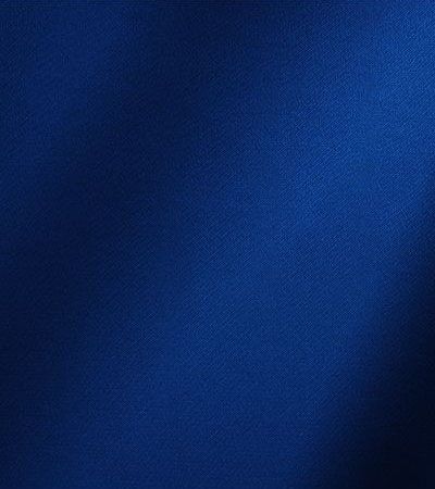 Deep royal blue textured fabric background.