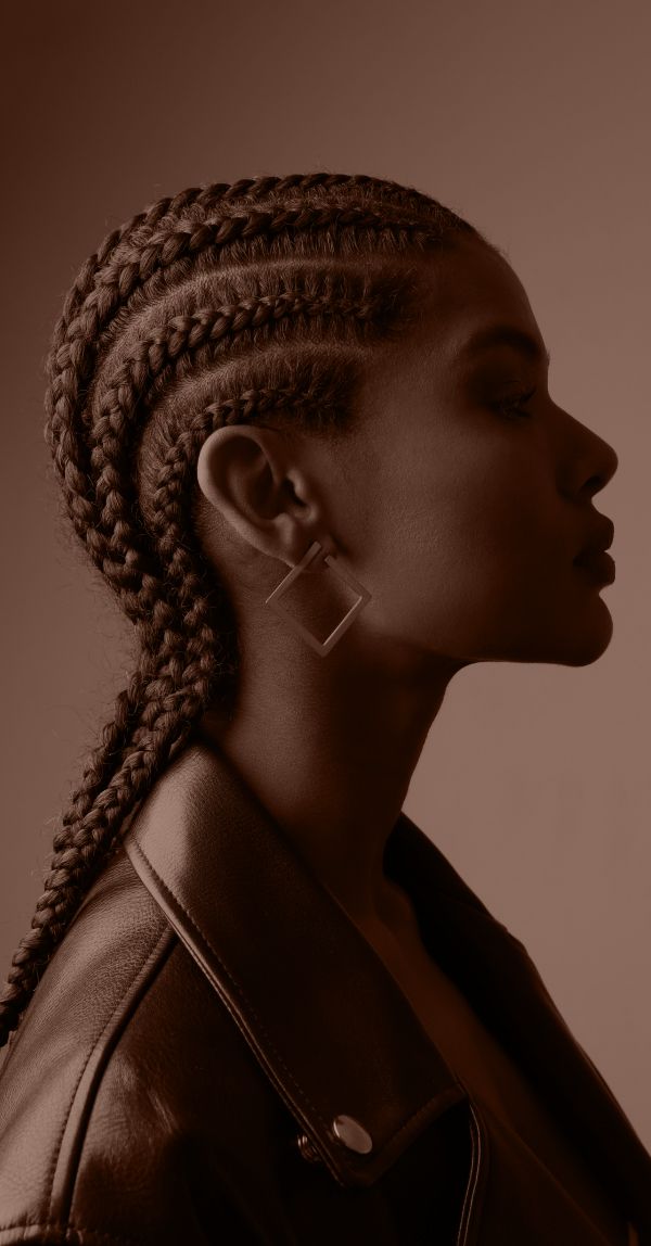 Profile of a woman with braided hairstyle.