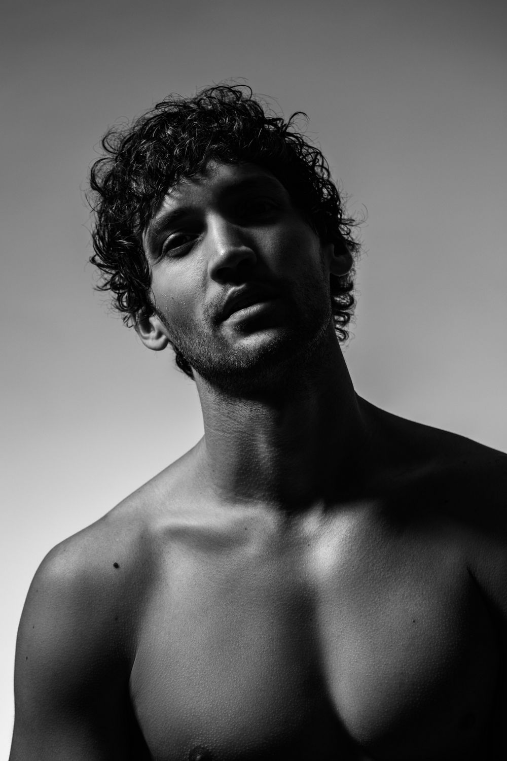 Close-up of a woman's face with soft makeup.