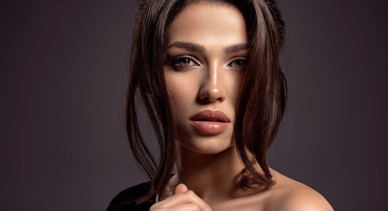 Close-up portrait of a woman with soft makeup.